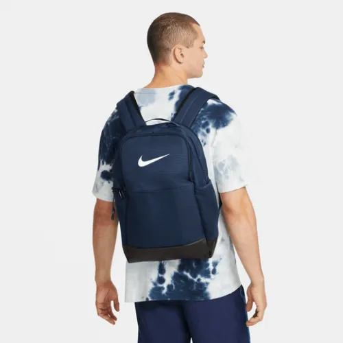 Nike Brasilia 9.5 Medium Backpack Navy  Grab your gear and get going with the Nike Brasilia Backpack. It has plenty of pockets t